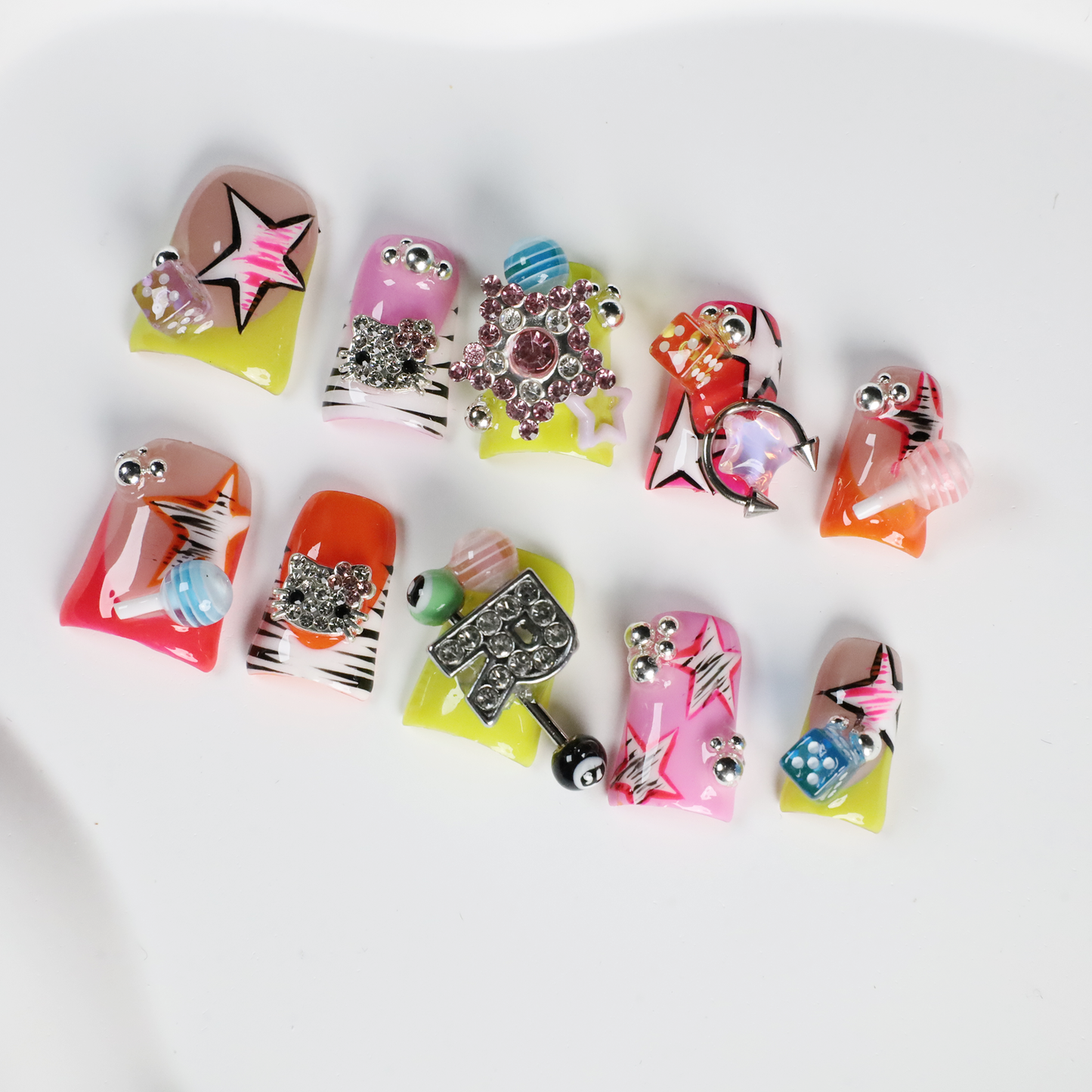 A hand with intricately decorated Neon Pop Star Short Duck Press-On Nails by We Do Nails clutches a large white mug. The duck-shaped neon nails showcase various designs, gems, and tiny figures. A pink banner in the top left corner reads SHIP NEXT DAY.