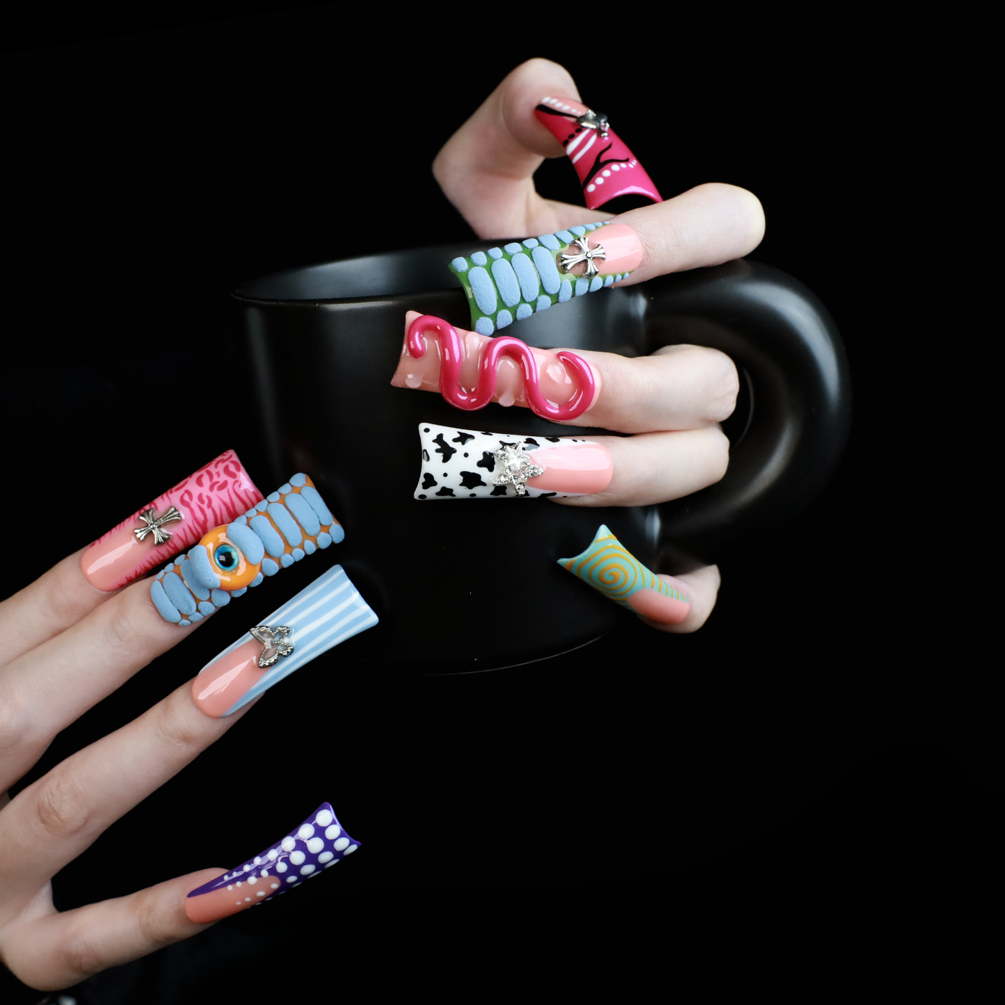 Two hands showcase the Avant-Garde 3D Extra Long Duck Nails by We Do Nails, featuring blue textures, cow print, pink patterns, and colorful designs against a black background. Ship Next Day text highlights custom size and nail measurement personalization options.