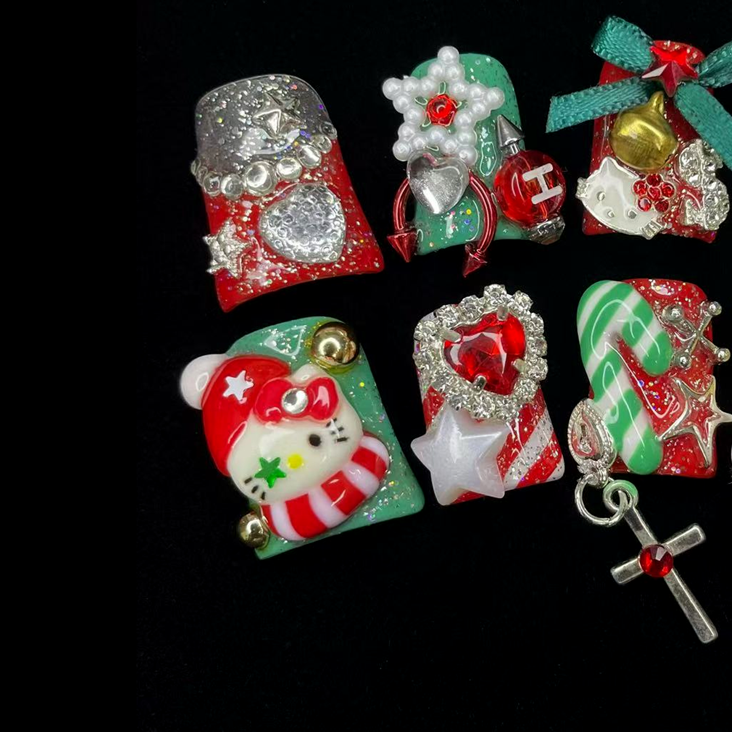 Embrace the season with We Do Nails Luxurious Christmas Short Duck Press-On Nails, featuring handmade 3D art of snowmen, Santa, and candy canes. Adorned with bows, stars, and a cross charm on a chic black background.