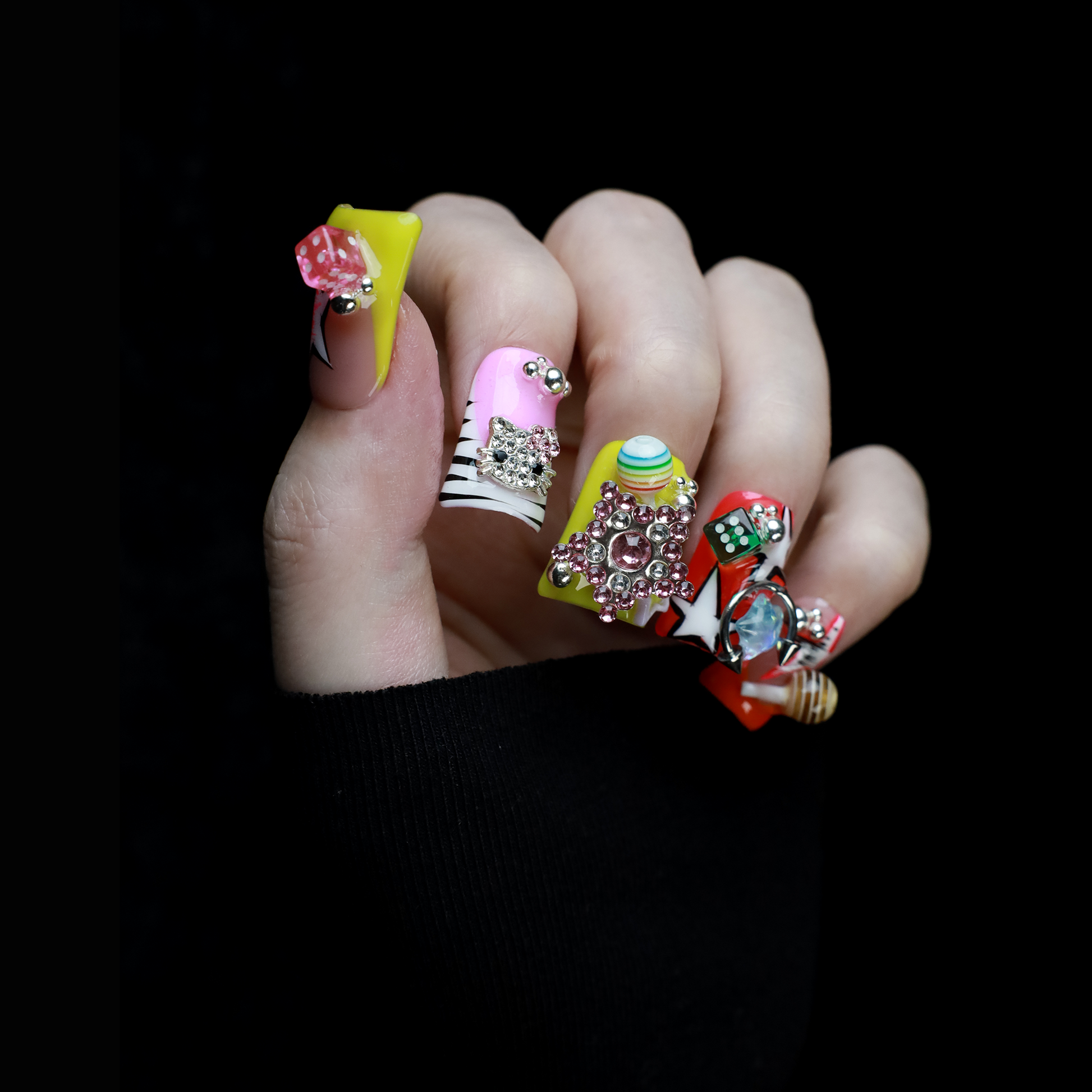 A hand with intricately decorated Neon Pop Star Short Duck Press-On Nails by We Do Nails clutches a large white mug. The duck-shaped neon nails showcase various designs, gems, and tiny figures. A pink banner in the top left corner reads SHIP NEXT DAY.