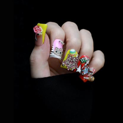 A hand with intricately decorated Neon Pop Star Short Duck Press-On Nails by We Do Nails clutches a large white mug. The duck-shaped neon nails showcase various designs, gems, and tiny figures. A pink banner in the top left corner reads SHIP NEXT DAY.