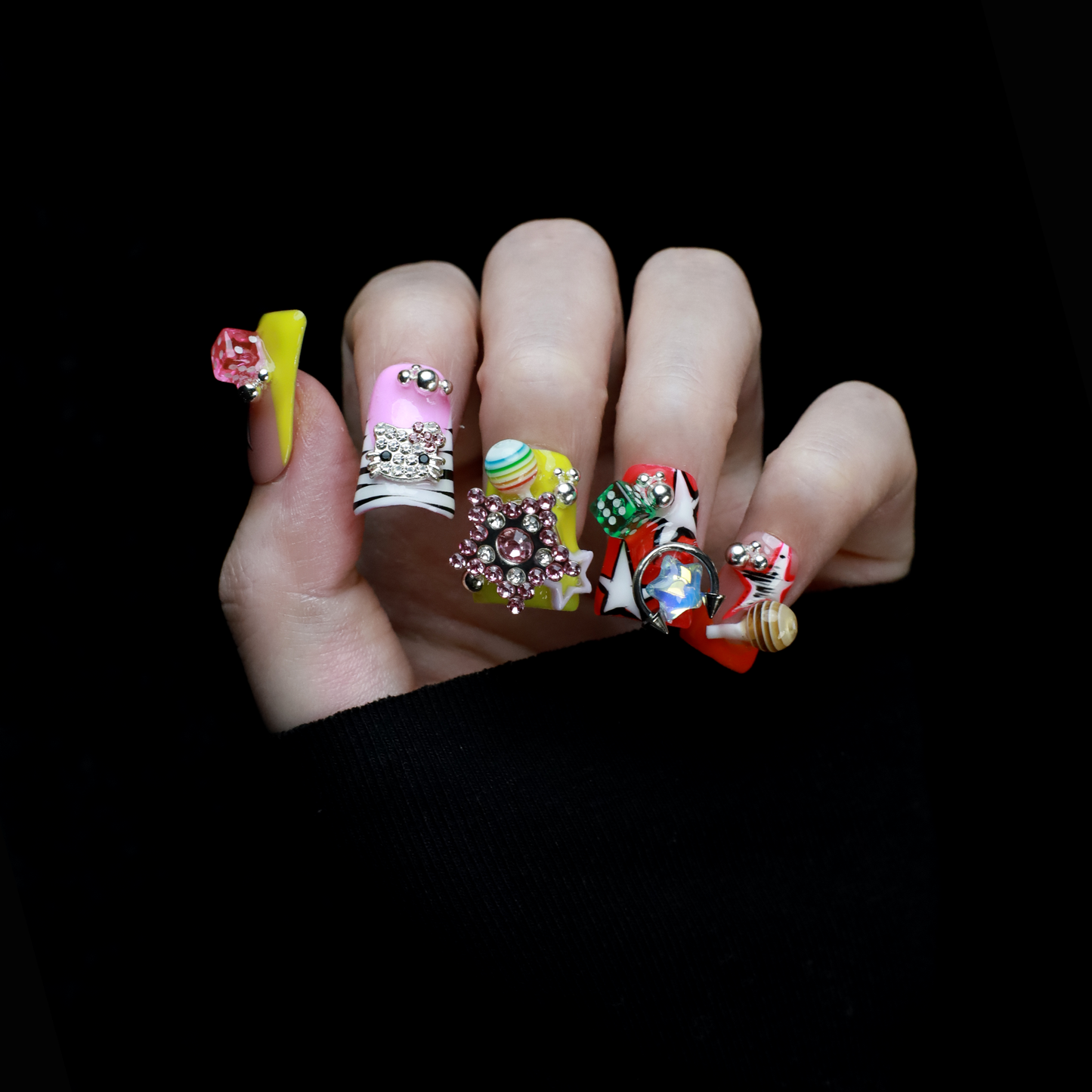 A hand with intricately decorated Neon Pop Star Short Duck Press-On Nails by We Do Nails clutches a large white mug. The duck-shaped neon nails showcase various designs, gems, and tiny figures. A pink banner in the top left corner reads SHIP NEXT DAY.