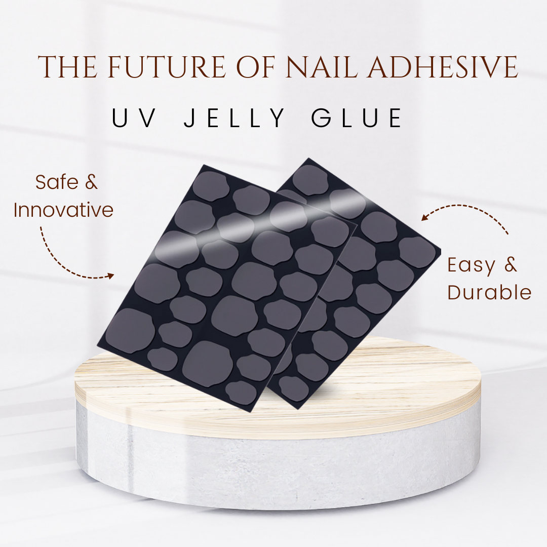 Two sheets of WeDoNails Best Nail Glue For Press On Nails with a pebble pattern sit on a round wooden platform. The text reads The Future of Nail Adhesive, emphasizing its safety, innovation, ease, and durability for nail applications. A soft, bright background enhances this cutting-edge product.